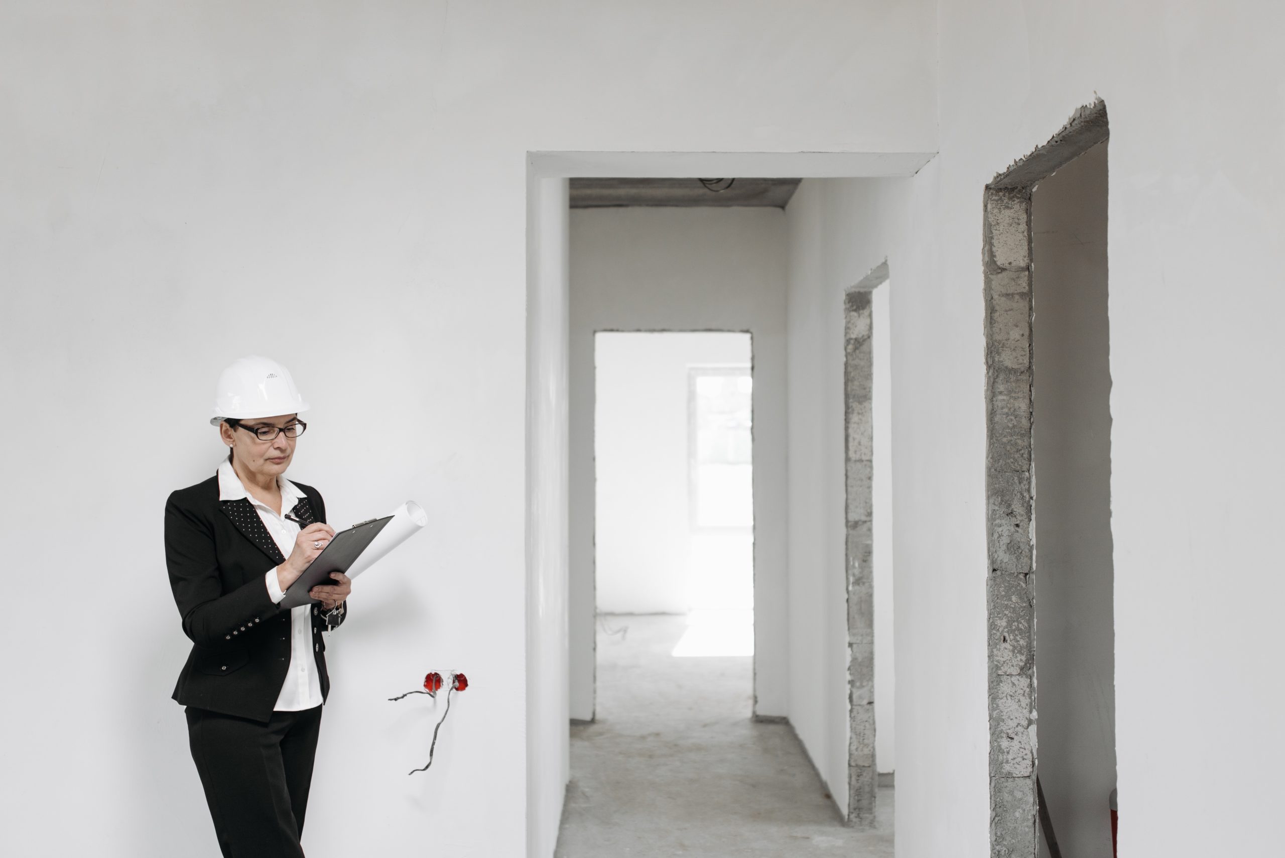 A woman assessing a house remodel project